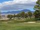 Expansive golf course with manicured greens, sand traps, and a mountain backdrop, ideal for golf enthusiasts at 4695 E Lucera Ct, Pahrump, NV 89061