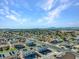 High-angle aerial shot of a large neighborhood with distant mountain views under a sunny sky at 4708 Thunderbolt Ave, Las Vegas, NV 89115
