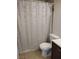 Bathroom with shower featuring a shower curtain, toilet, and vanity at 4708 Thunderbolt Ave, Las Vegas, NV 89115