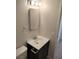 Bathroom vanity with dark brown cabinets, white countertop, and a mirror at 4708 Thunderbolt Ave, Las Vegas, NV 89115