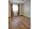 Bedroom with hardwood floors, neutral paint, and window at 4708 Thunderbolt Ave, Las Vegas, NV 89115