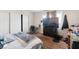 This bedroom features wood floors, closet, window, and room for a workspace at 4708 Thunderbolt Ave, Las Vegas, NV 89115