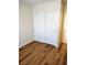 This bedroom features wood floors and a white closet with sliding doors at 4708 Thunderbolt Ave, Las Vegas, NV 89115