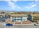 Two story apartment building featuring a balcony and yard surrounded by chain link fence at 4708 Thunderbolt Ave, Las Vegas, NV 89115