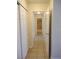 Hallway featuring white closet doors and a bathroom at the end at 4708 Thunderbolt Ave, Las Vegas, NV 89115