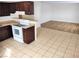 View of the kitchen, tile flooring, and a glimpse into the living room at 4708 Thunderbolt Ave, Las Vegas, NV 89115