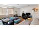Spacious living room provides comfortable furniture and a TV at 4708 Thunderbolt Ave, Las Vegas, NV 89115