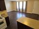 An open floorplan from the kitchen to the living room with wood floors at 4708 Thunderbolt Ave, Las Vegas, NV 89115