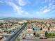 Neighborhood featuring two-story apartment buildings and streets on a clear, sunny day at 4708 Thunderbolt Ave, Las Vegas, NV 89115