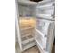 Clean, well-lit refrigerator with adjustable shelves and ample storage space at 4708 Thunderbolt Ave, Las Vegas, NV 89115