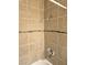 Shower featuring tiled walls, shower head, and faucet at 4708 Thunderbolt Ave, Las Vegas, NV 89115