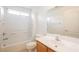 Bathroom features a tub and shower combination, and a vanity with wooden cabinetry at 4847 Double Down Dr # 101, Las Vegas, NV 89122