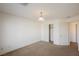 A neutral-toned bedroom has carpet flooring, a ceiling fan, and closet for ample storage at 4847 Double Down Dr # 101, Las Vegas, NV 89122