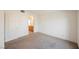 Carpeted bedroom featuring an ensuite bathroom and neutral walls at 4847 Double Down Dr # 101, Las Vegas, NV 89122