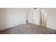 Neutral bedroom featuring carpet floors and access to additional rooms at 4847 Double Down Dr # 101, Las Vegas, NV 89122