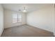Bedroom with neutral walls, carpet, and natural light from the window at 4847 Double Down Dr # 101, Las Vegas, NV 89122