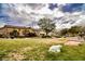 Neighborhood park showcasing an open grassy area, mature trees, and unique frog sculptures at 4847 Double Down Dr # 101, Las Vegas, NV 89122