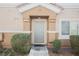 Charming townhome entrance featuring desert landscaping and modern design elements at 4847 Double Down Dr # 101, Las Vegas, NV 89122