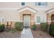 Cozy townhome entrance with well-kept landscaping and inviting front door at 4847 Double Down Dr # 101, Las Vegas, NV 89122