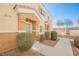 Inviting townhome entrance with desert landscaping and a well-maintained walkway at 4847 Double Down Dr # 101, Las Vegas, NV 89122