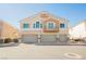 Inviting exterior view of townhomes with attached garages and well-maintained landscaping at 4847 Double Down Dr # 101, Las Vegas, NV 89122