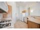 Bright kitchen with tile floors, white appliances, and oak cabinets at 4847 Double Down Dr # 101, Las Vegas, NV 89122