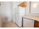 Efficient kitchen featuring white appliances and convenient storage spaces at 4847 Double Down Dr # 101, Las Vegas, NV 89122