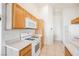 Efficient kitchen space with white appliances and tile flooring at 4847 Double Down Dr # 101, Las Vegas, NV 89122
