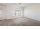 Bright living room with carpet and a large window at 4847 Double Down Dr # 101, Las Vegas, NV 89122