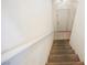 Carpeted stairs lead to the front door with a white railing on the side at 4847 Double Down Dr # 101, Las Vegas, NV 89122