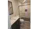 Updated bathroom with marble vanity, tiled shower, and neutral finishes at 4905 Danbrook Ct, Las Vegas, NV 89110