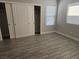 Bedroom showcasing a large sliding closet, new floors and new windows at 4905 Danbrook Ct, Las Vegas, NV 89110