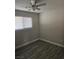 This bedroom features new tile floor, neutral colored walls and a window at 4905 Danbrook Ct, Las Vegas, NV 89110