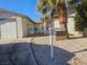 Charming single-story home with desert landscaping, palm tree, and gated front entrance at 4905 Danbrook Ct, Las Vegas, NV 89110