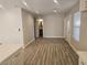 Open floor plan with updated lighting, tile flooring, stainless steel appliances and a modern kitchen at 4905 Danbrook Ct, Las Vegas, NV 89110
