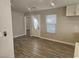 Bright living room with new tile flooring, recessed lighting, and a modern front door at 4905 Danbrook Ct, Las Vegas, NV 89110