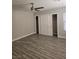 Main bedroom showcasing a ceiling fan, updated lighting, new floors and sliding closet doors at 4905 Danbrook Ct, Las Vegas, NV 89110
