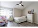 Cozy bedroom features a comfortable bed, matching nightstands, and neutral decor at 4923 Strauss Dr, Las Vegas, NV 89146