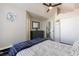 Spacious bedroom with a ceiling fan, closet, and an attractive color palette at 4923 Strauss Dr, Las Vegas, NV 89146