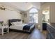 Comfortable bedroom featuring large window, vaulted ceilings, and en-suite bathroom at 4923 Strauss Dr, Las Vegas, NV 89146
