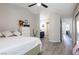 Spacious bedroom with connecting bathroom, features modern decor, and stylish gray floors at 4923 Strauss Dr, Las Vegas, NV 89146