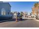 Gated community entrance, with well-maintained landscape at 4923 Strauss Dr, Las Vegas, NV 89146
