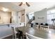 Open concept dining area connecting to living space, staircase, and natural light at 4923 Strauss Dr, Las Vegas, NV 89146