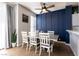 Bright dining area with a modern table, ample seating, and decorative wall at 4923 Strauss Dr, Las Vegas, NV 89146