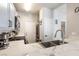 Open-concept kitchen with marble counters, modern appliances, and stylish fixtures at 4923 Strauss Dr, Las Vegas, NV 89146