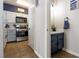 Charming kitchen featuring modern appliances, tile floors and stylish, contrasting cabinetry at 4923 Strauss Dr, Las Vegas, NV 89146