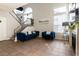 Bright living room with staircase, comfortable seating, and neutral decor at 4923 Strauss Dr, Las Vegas, NV 89146