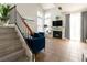 Bright living room featuring a fireplace, staircase, and comfortable seating at 4923 Strauss Dr, Las Vegas, NV 89146