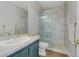 Bathroom features a marble-tiled shower with glass door and a stylish vanity at 501 Tuscany View St, Las Vegas, NV 89145