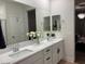 Elegant bathroom with double vanity, stylish mirrors, and ample counter space with updated cabinets at 5230 Lissome Lily Ct, Las Vegas, NV 89139